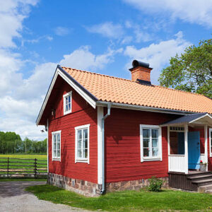 Red Cottage On The Swedish Countryside.